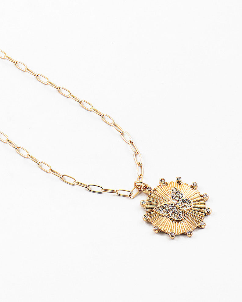 Gold paperclip/disc with clear butterfly