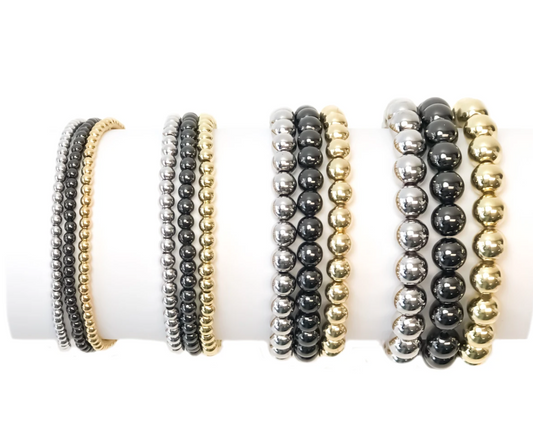 stackable beaded bracelets in gold, silver, gunmetal and rose gold